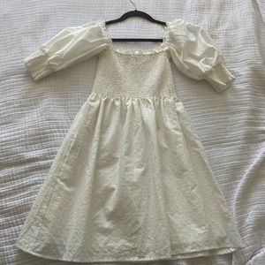 Caara white puff sleeved dress with smock bodice. Purchased from saks